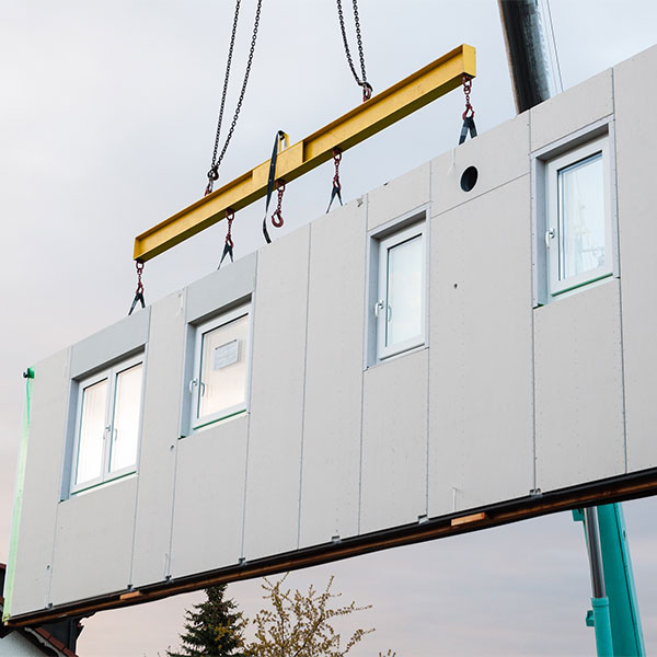 Modular panel hoisted by crane